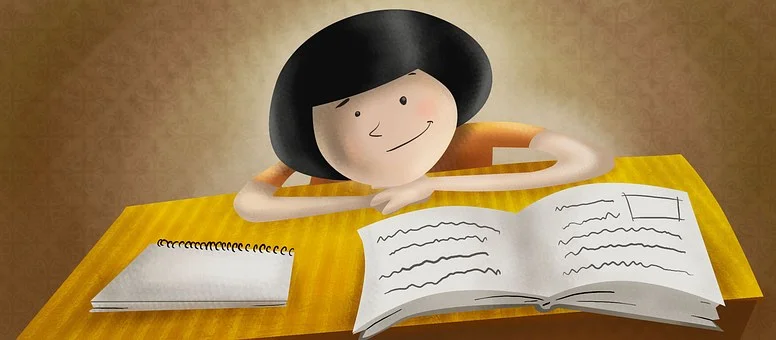girl-at-a-desk-with-open-book